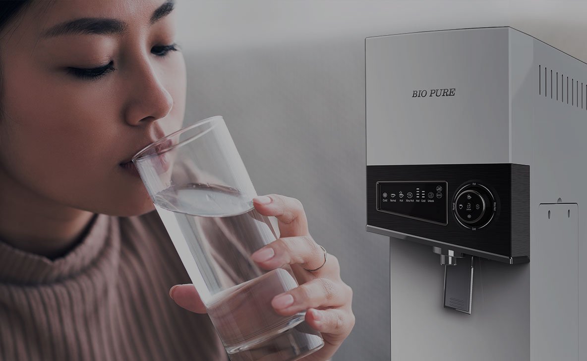 Woman drinking purified water from the Bio Pure N-Series